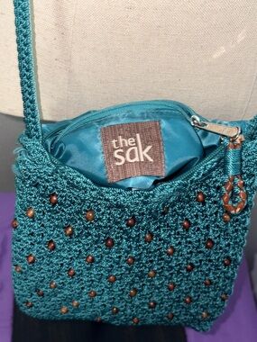 The Sak Teal Crochet Crossbody Bag with Bead Accents